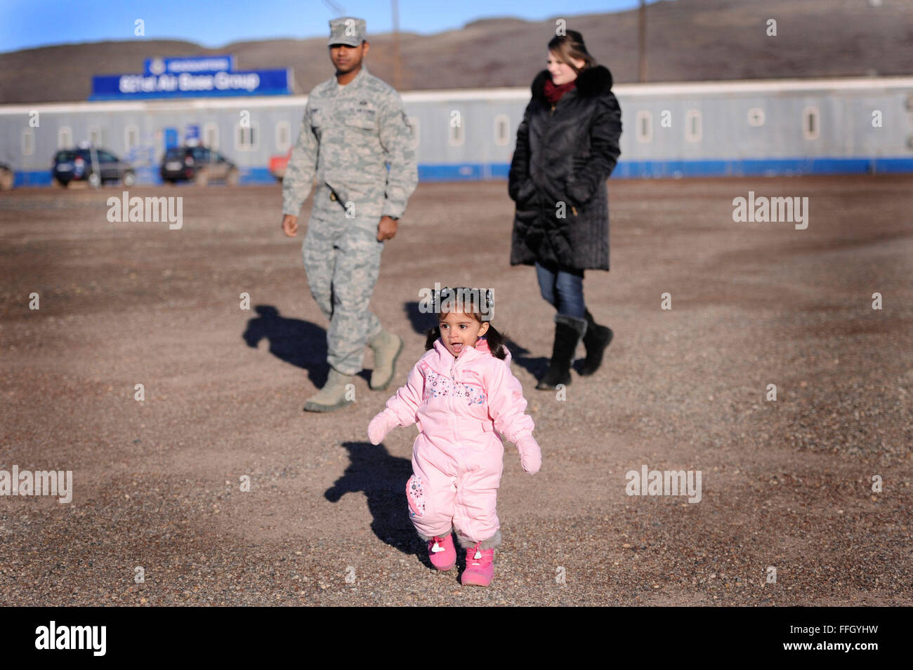 Staff Sgt. Siddharth Sunny, his wife, Shauna, and their daughter, Clara, take a walk at Thule AB. Although a visiting dependent is not rare, Clara is believed to be the youngest dependent to visit the base. Stock Photo