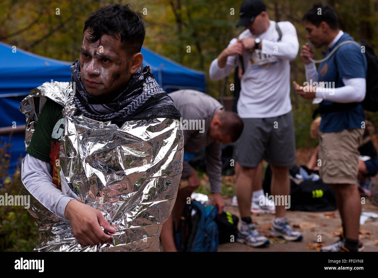 After a 7-mile duckie race, Army Spc. Melvin Martinez-Meza covers himself in a thermal blanket so he won't lose body heat. Stock Photo
