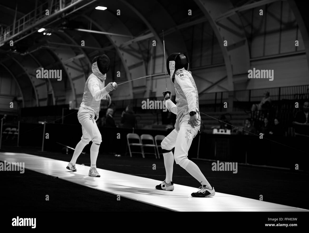 Alexander Chiang (right) practices with David Kong, from the New Jersey Institute of Technology, to prepare for their upcoming matches. Chiang competed in the men's foil category. Stock Photo