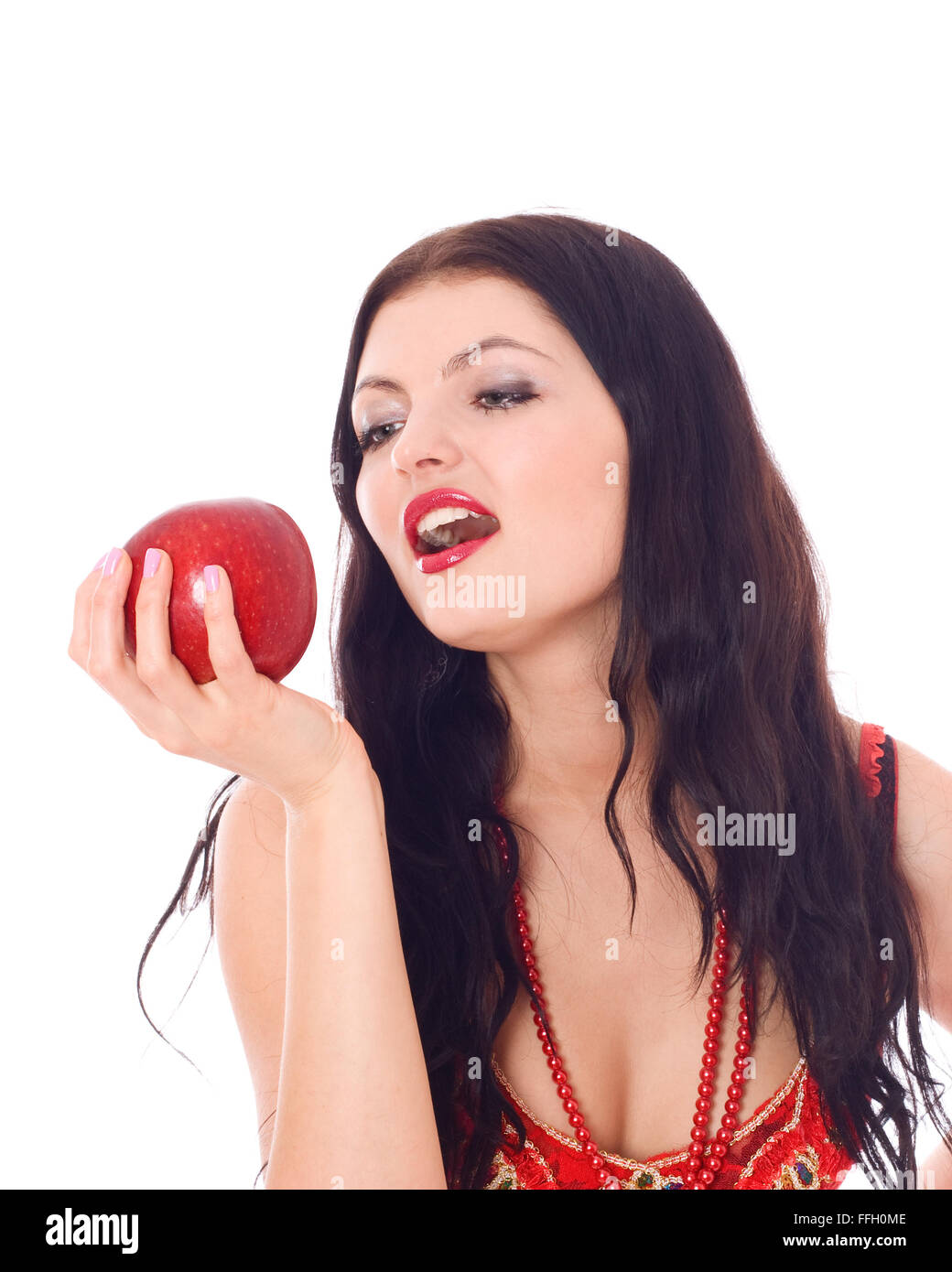 Young beautiful girl with red fruit in her hand, isolated on white Stock Photo