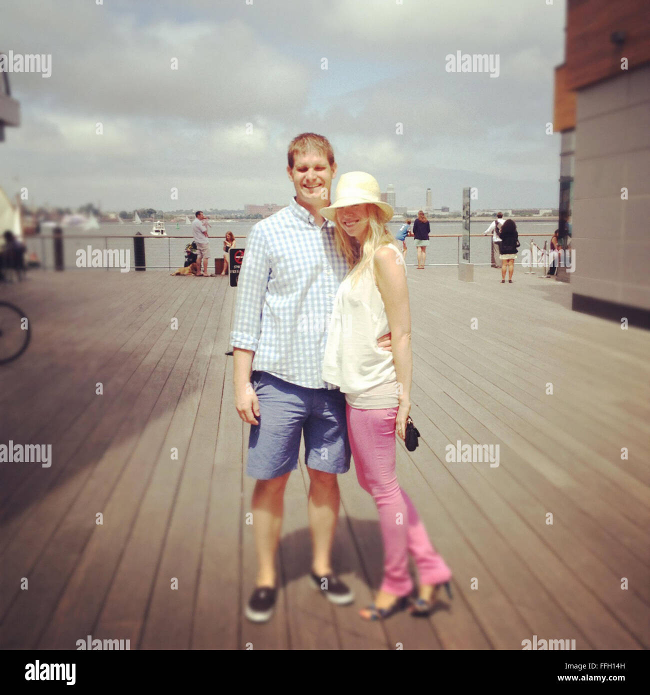 Capt. Adam Davis and his wife, Adrianne, at the Boston inner harbor
