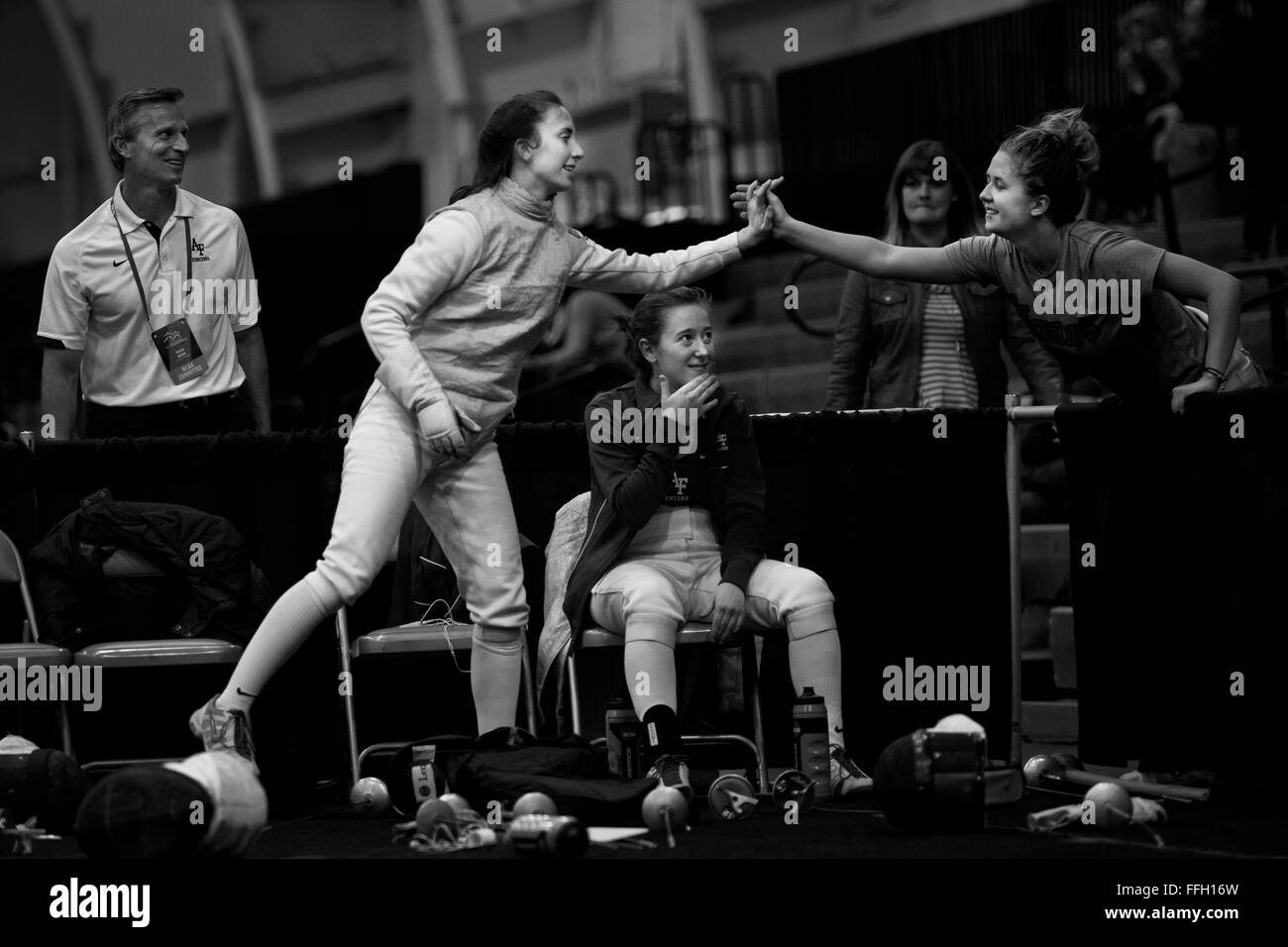 Madeleine Girardot high fives a friend from another college after winning a match during the 2014 NCAA Fencing Championships at Ohio State University in Columbus, Ohio. Girardot is a sophomore cadet at the Air Force Academy. Stock Photo