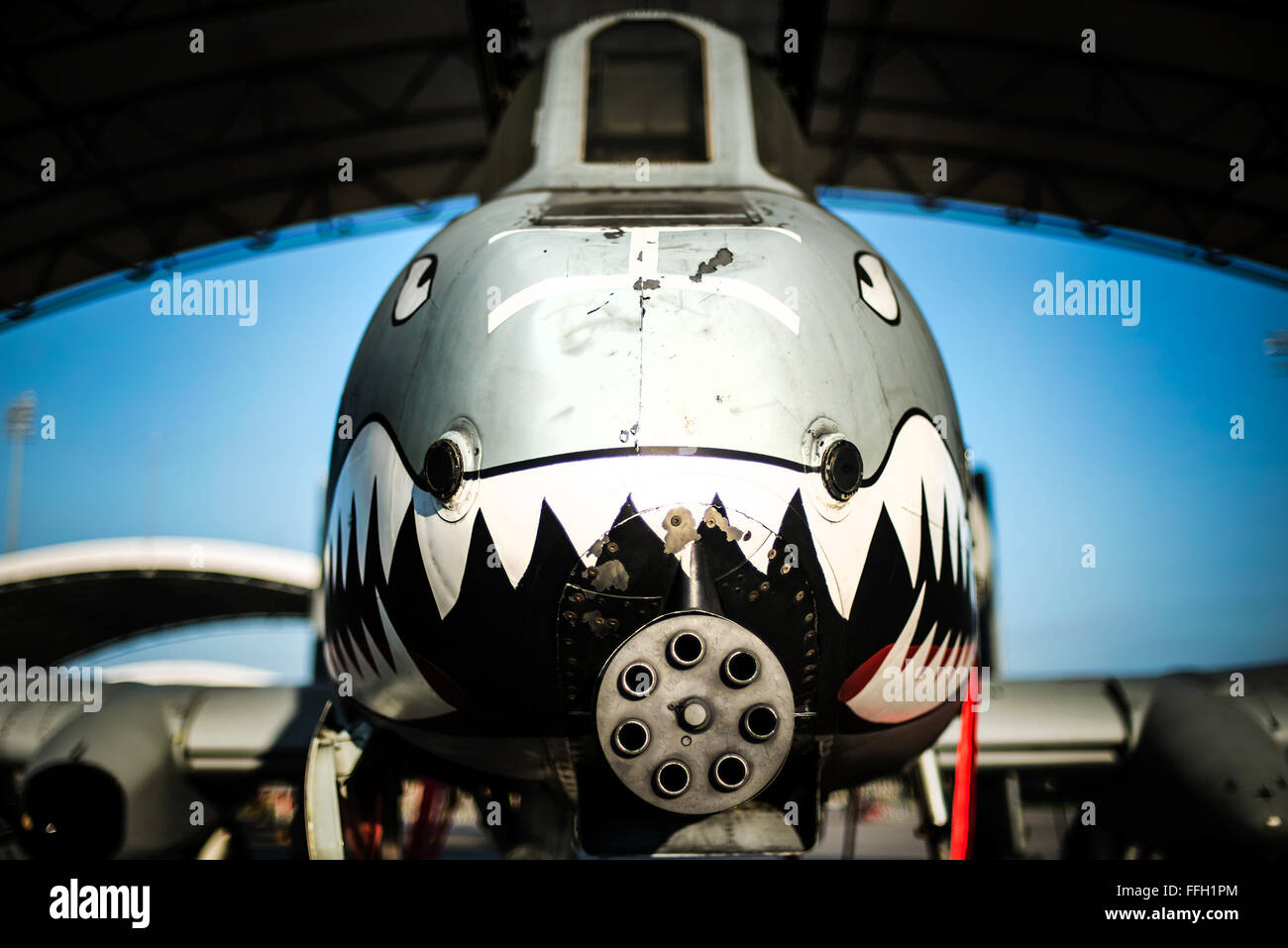 An A-10C Thunderbolt II sits under a sun shade at Moody Air Force Base, Ga. The A-10Õs primary weapon is a single 30mm GAU-8/A seven-barrel Gatling gun. It can also carry up to 16,000 pounds of mixed ordnance such as cluster bomb units, joint direct attack munitions and AIM-9 Sidewinder missiles. Stock Photo