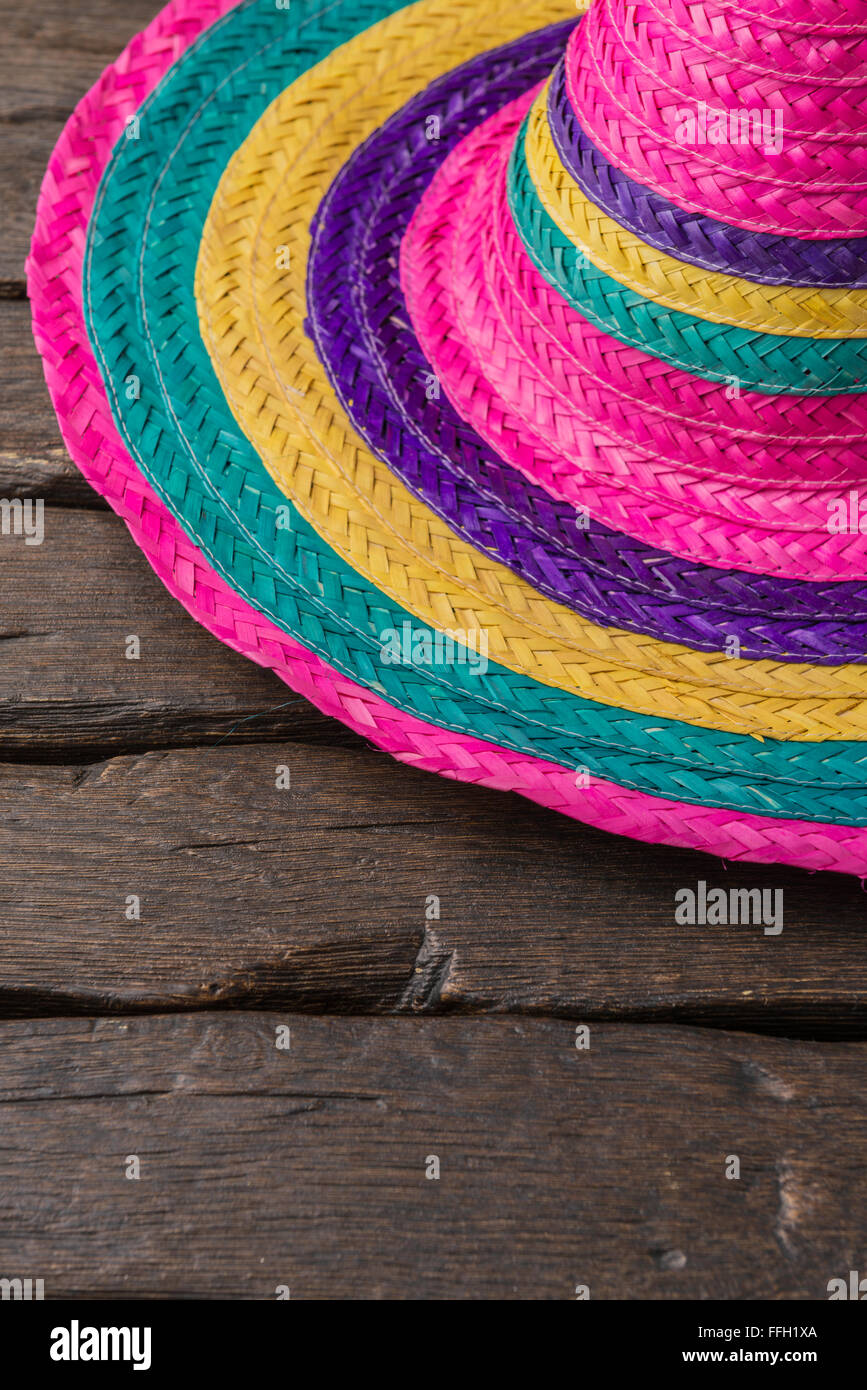 Mexican sombrero on old dark wood background Stock Photo - Alamy