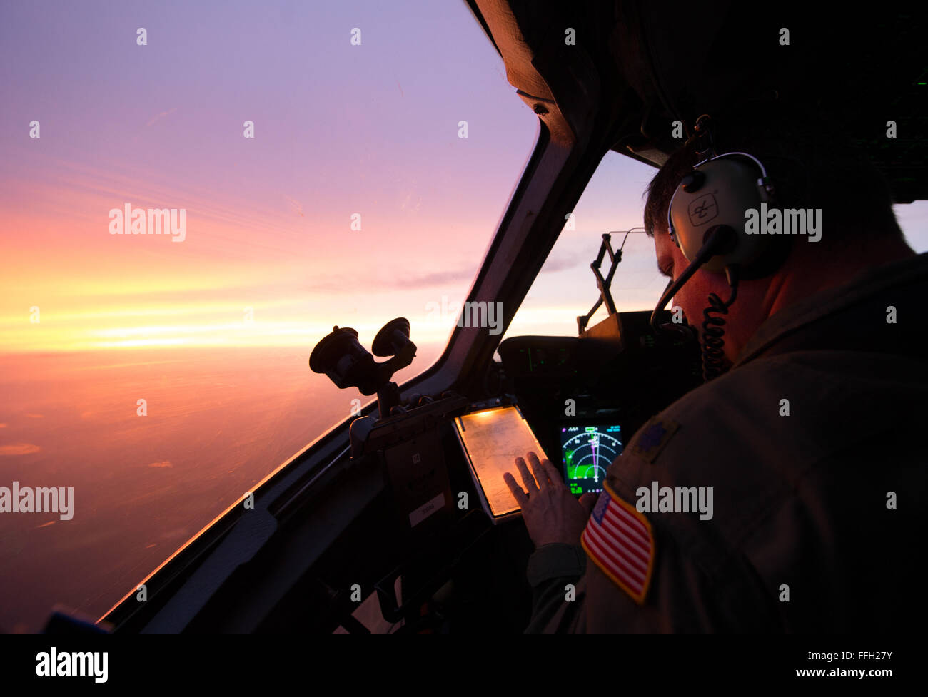 Lt. Col. Matthew Yaun conducts aerial operations during a training flight onboard a C-17 Globemaster III near Joint Base Charleston, S.C. Training flights are vital to the operational success of Airmen because they help develop the necessary skills for combat and humanitarian missions. Yaun is a pilot assigned to the 300th Airlift Squadron. Stock Photo