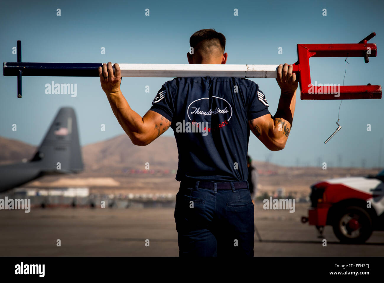 Staff Sgt. Stanley Weaver, the Thunderbird 4 dedicated crew chief, finishes positioning the Thunderbirds F-16 Fighting Falcons in preparation for a practice show at Nellis Air Force Base, Nev. Stock Photo