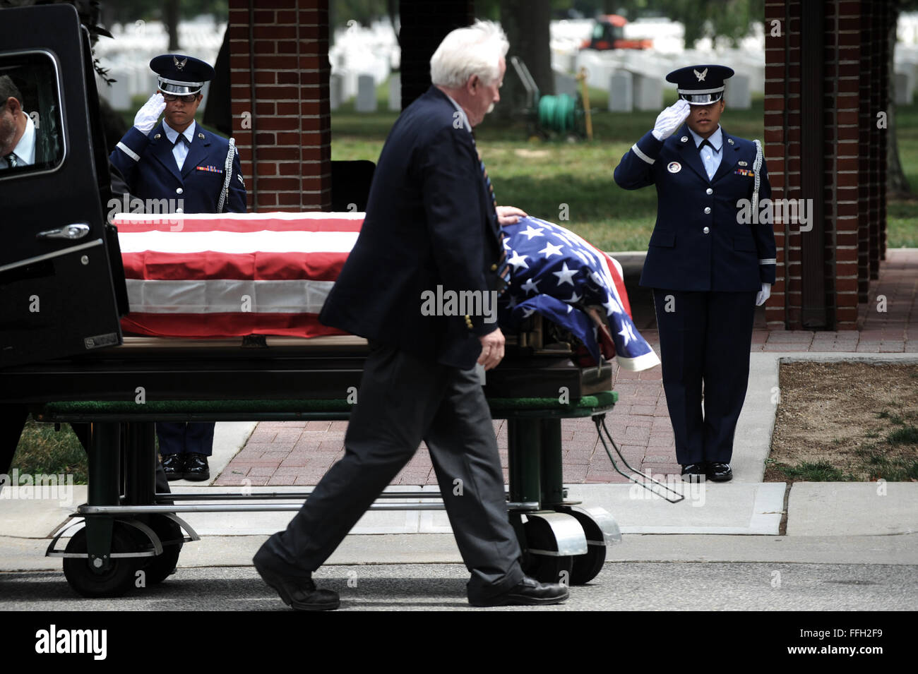 Members of the 106th Rescue Wing Honor Guard render a final salute as the body of Paul J. Ricioppi is laid to rest at Long Island National Cemetery in Farmingdale, N.Y. Ricioppi was an honorably discharged member of the Army Air Corps. (Air National Guard/Senior Airman Christopher S. Muncy/106th Rescue Wing Public Affairs) Stock Photo