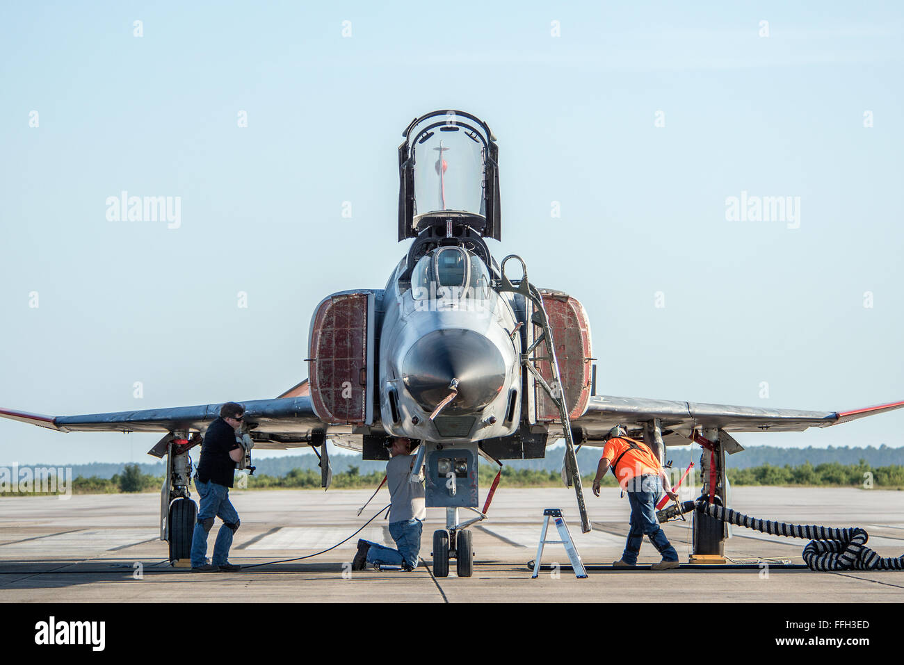 Members of the 82nd Aerial Target Squadron at Tyndall Air Force Base, Florida, prepare a QF-4 Phantom for a mission. The Q-F4 is an F-4 Phantom that has been converted to a remotely piloted aircraft for use as an aerial target. Stock Photo