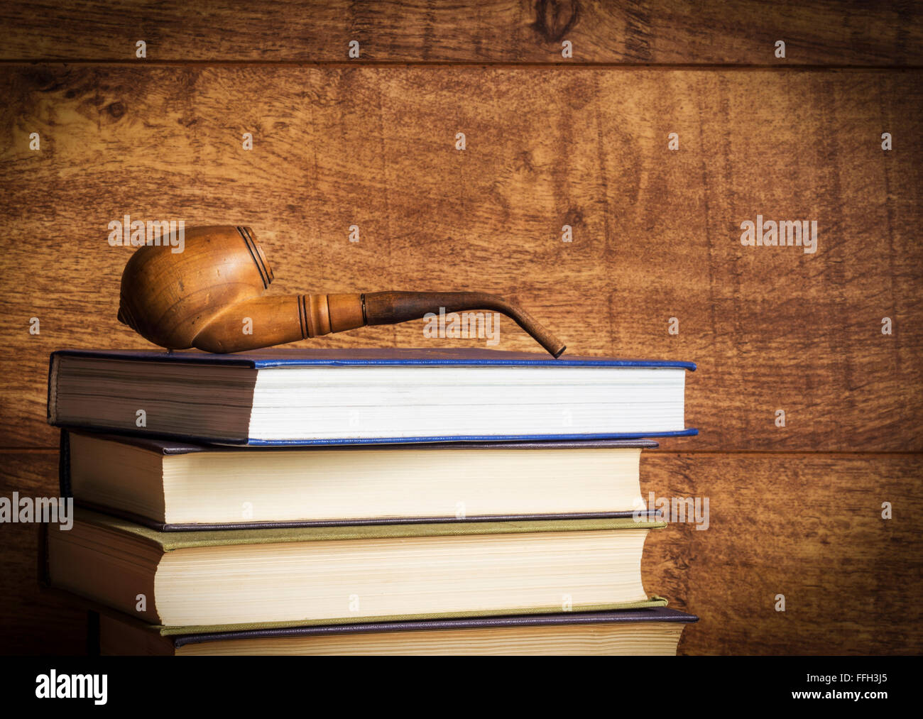 Old book on wooden background. Stock Photo
