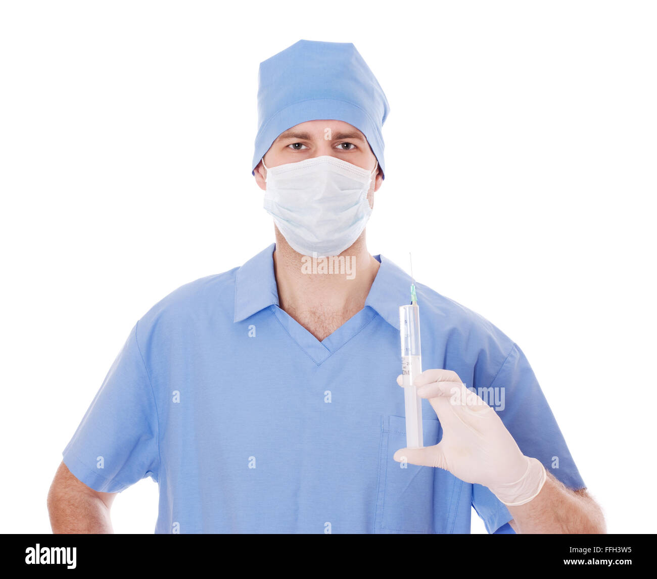 Full isolated studio picture from a young male doctor with syringe in his hand. Stock Photo