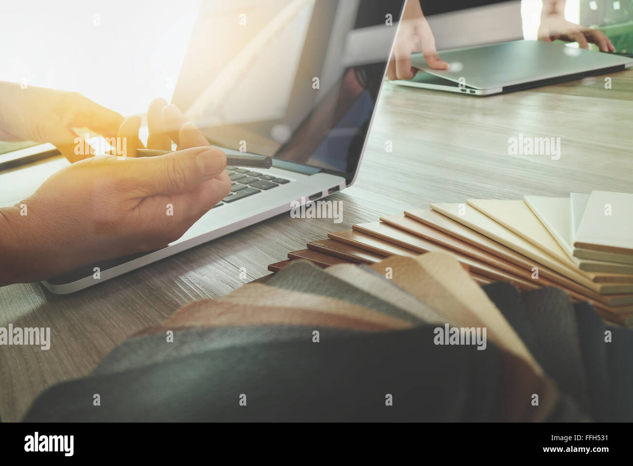 Interior designer hand working with new modern computer laptop and pro ...