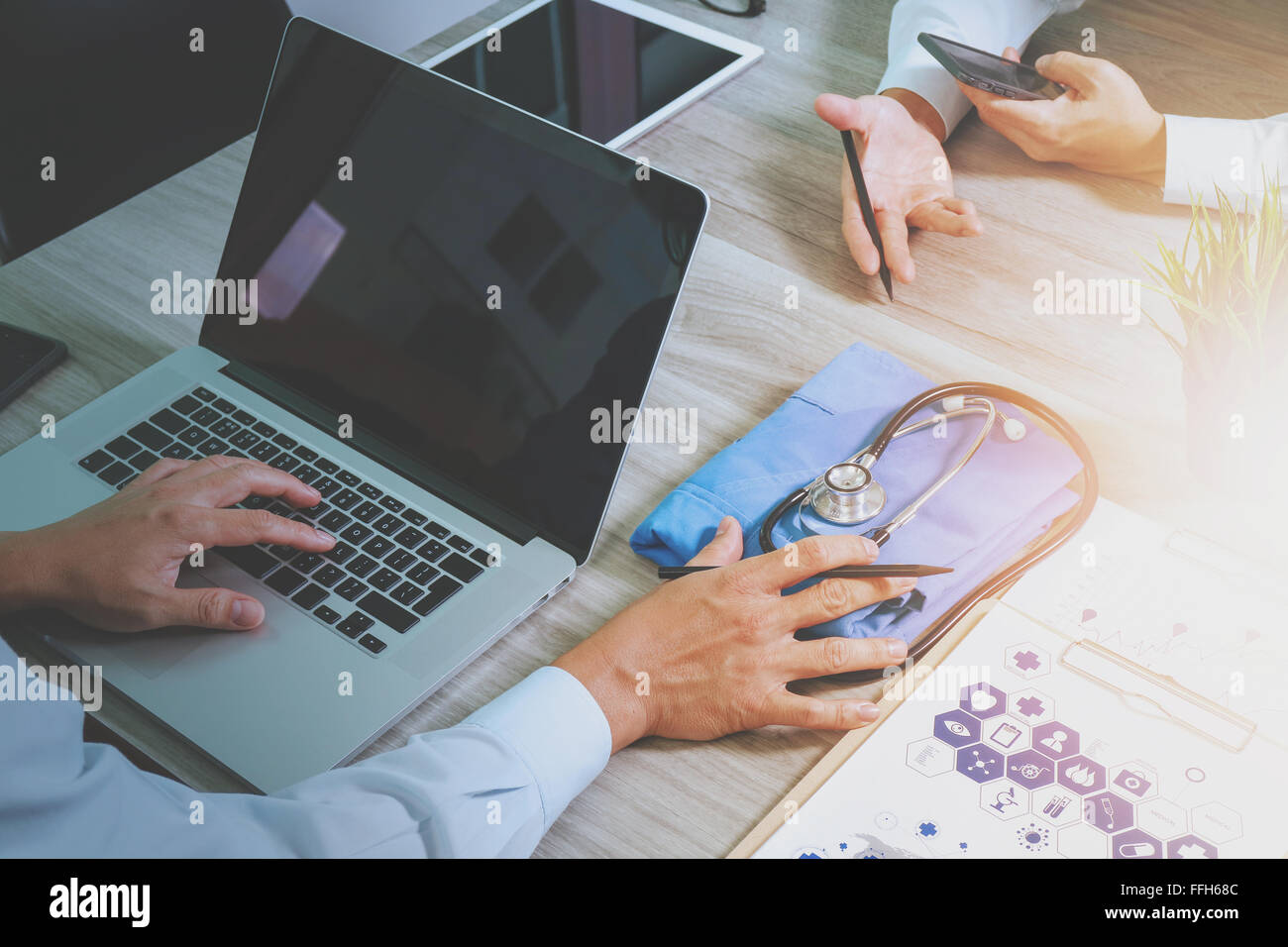 top view of Medicine doctor hand working with modern computer and ...