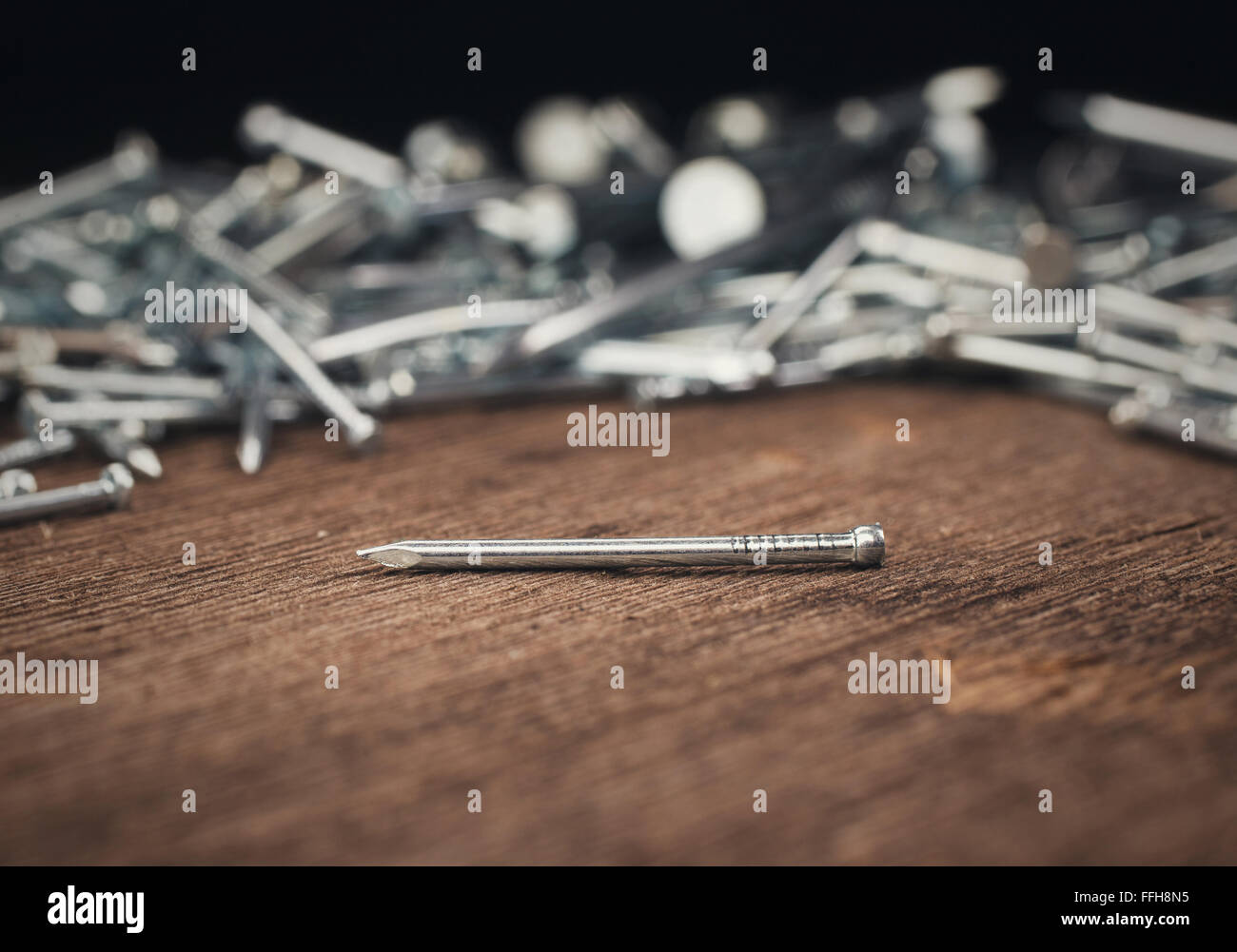 iron nails on wooden background Stock Photo