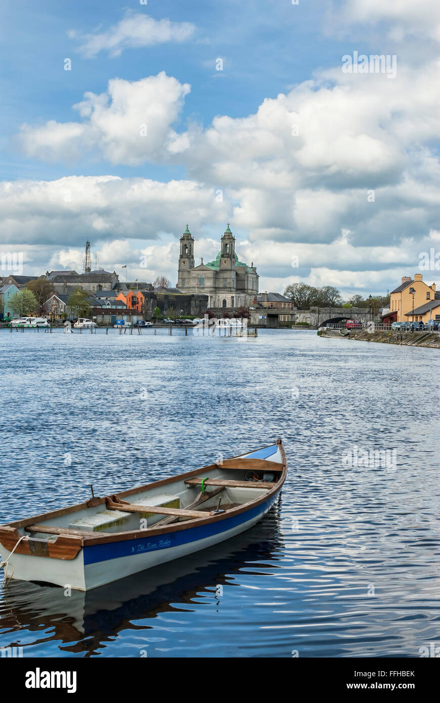 Rowing boat at the River Shannon with Athlone Cathedral in background, Ireland Stock Photo