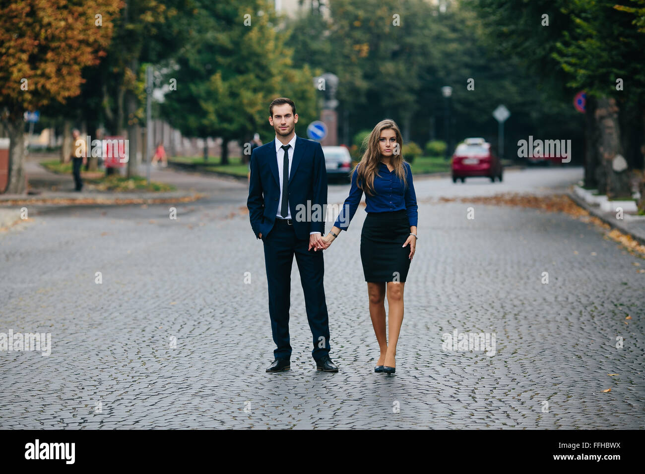 man and woman walking Stock Photo - Alamy