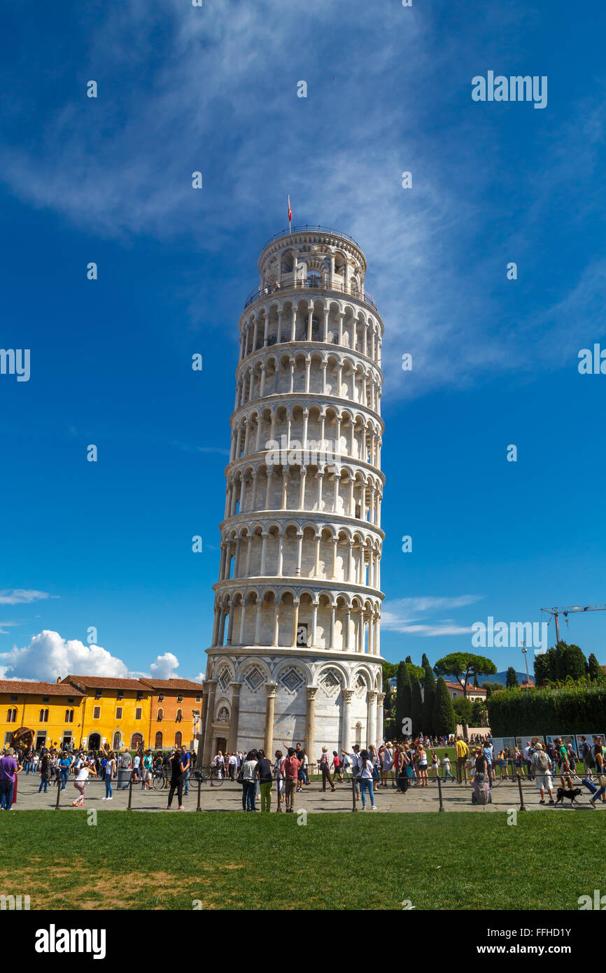 PISA, ITALY - SEPTEMBER 21, 2015 : View of historical Pisa Tower in Cathedral Square of Pisa, Italy, on bright blue sky. Stock Photo