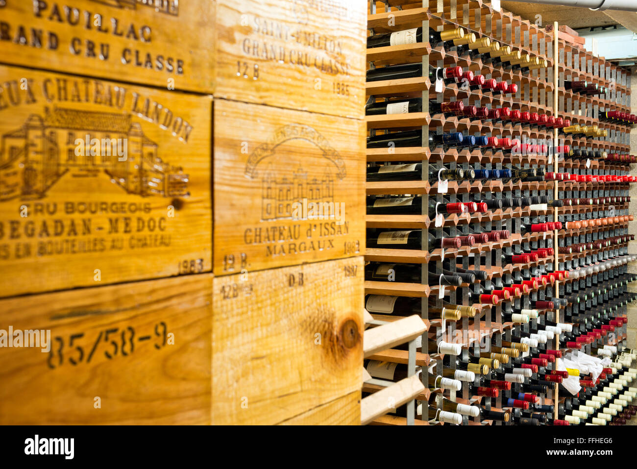 Collected bottles of wine in racks in a well stocked private. temperature controlled wine cellar