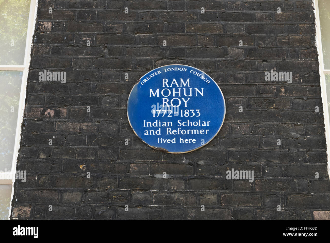 A commemorative blue plaque for Ram Mohun Roy (1772 - 1833) Indian Scholar on display on a wall in London, United Kingdom Stock Photo