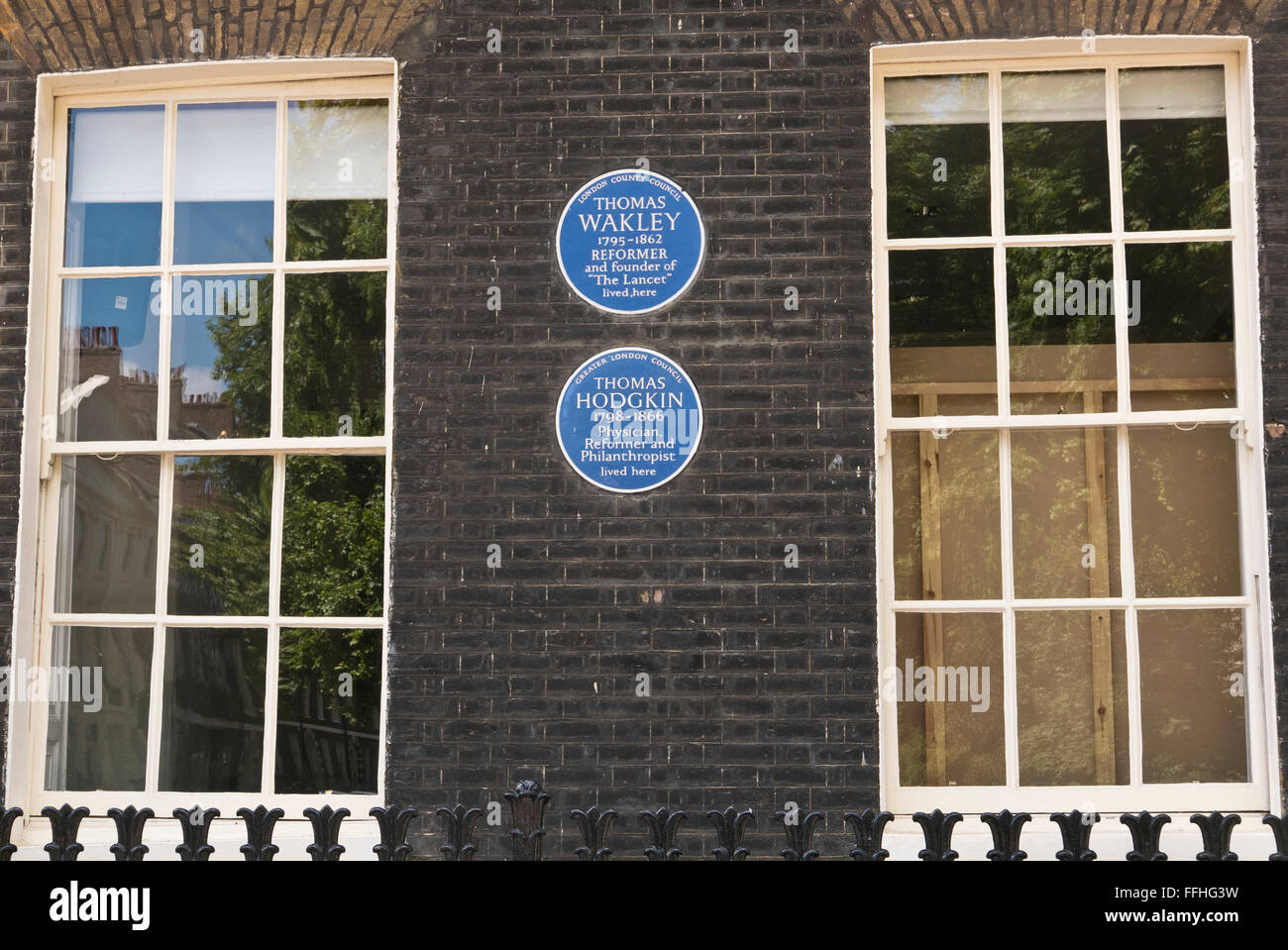 Two commemorative blue plaques for Thomas Wakley and Thomas Hodgkin on display on a wall in London, United Kingdom. Stock Photo