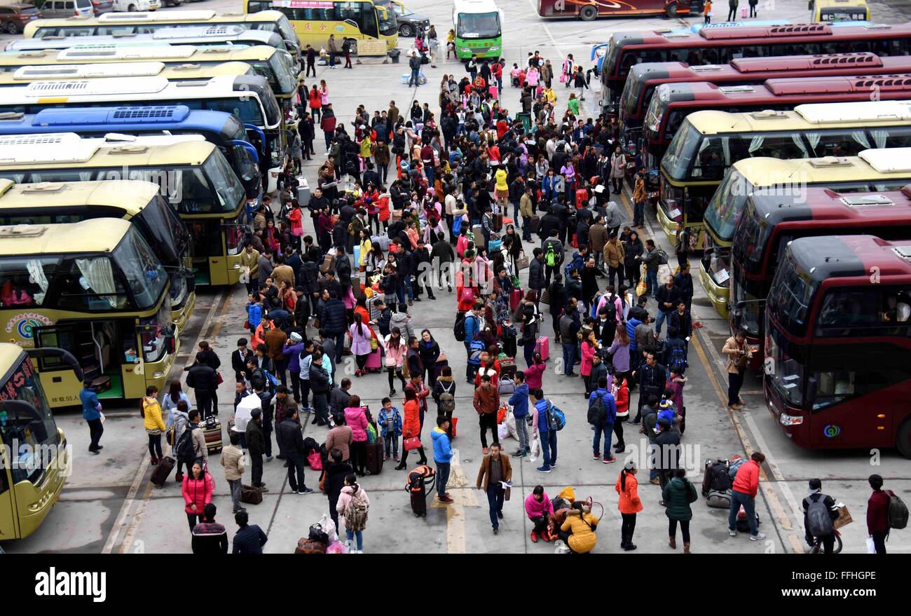 (160214) -- TONGREN, Feb. 14, 2016 (Xinhua) -- Passengers wait for getting on coaches at a passenger station in Songtao Miao Autonomous County of Tongren City, southwest China's Guizhou Province, Feb. 13, 2016. Chinese passengers made a record number of trips during the Spring Festival holiday, according to the Ministry of Transport (MOT) on Sunday. Passenger trips reached 400 million from Feb. 7 to 13, up 6.7 percent from last year, MOT data showed. Over 47 million trips were made by rail, more than 333 million on road and about 8.5 million by air. Road trips were up by 7 percent. (Xinhua/Lon Stock Photo