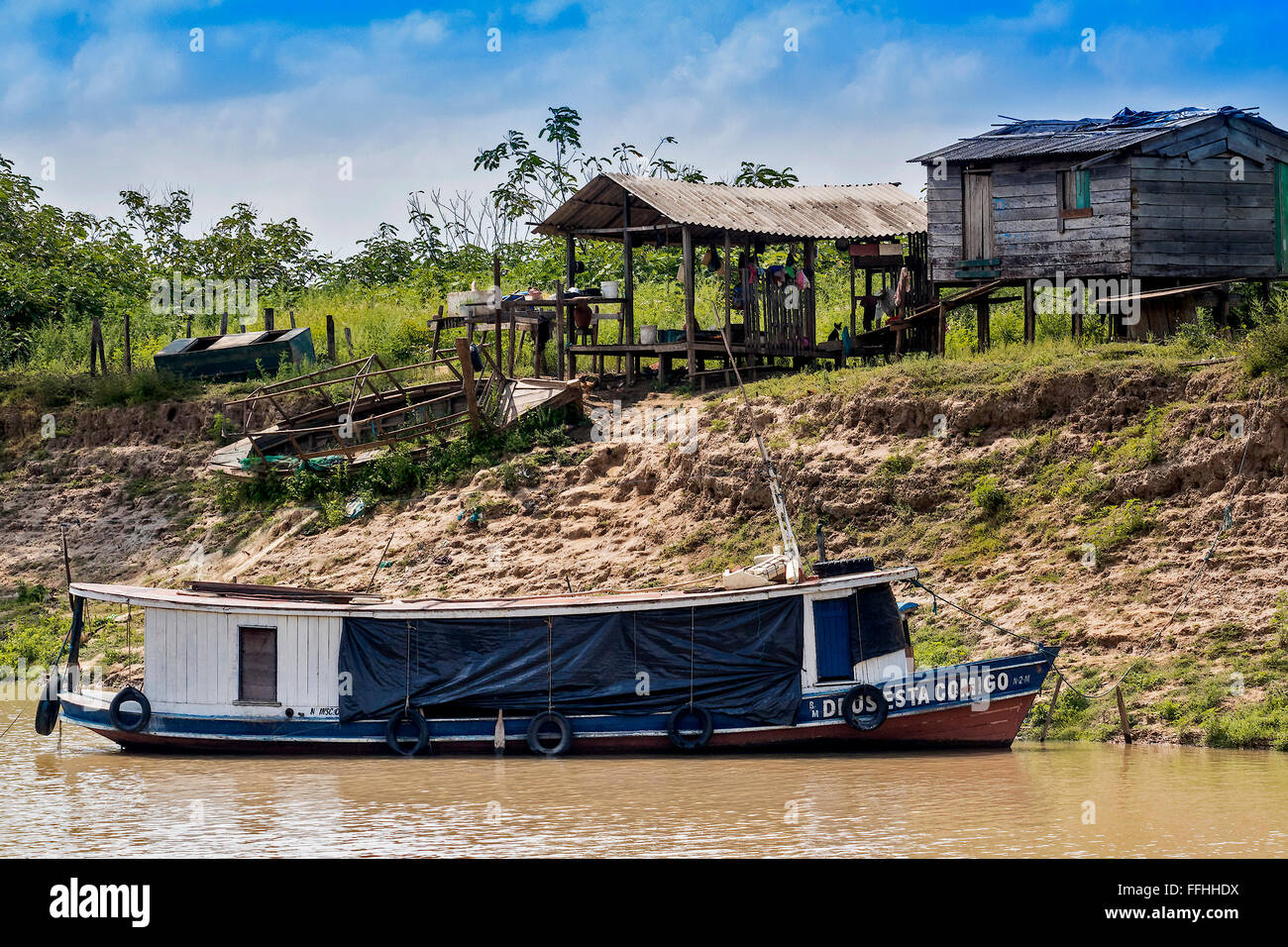 River Boat and House On Stilts Santarem Brazil Stock Photo