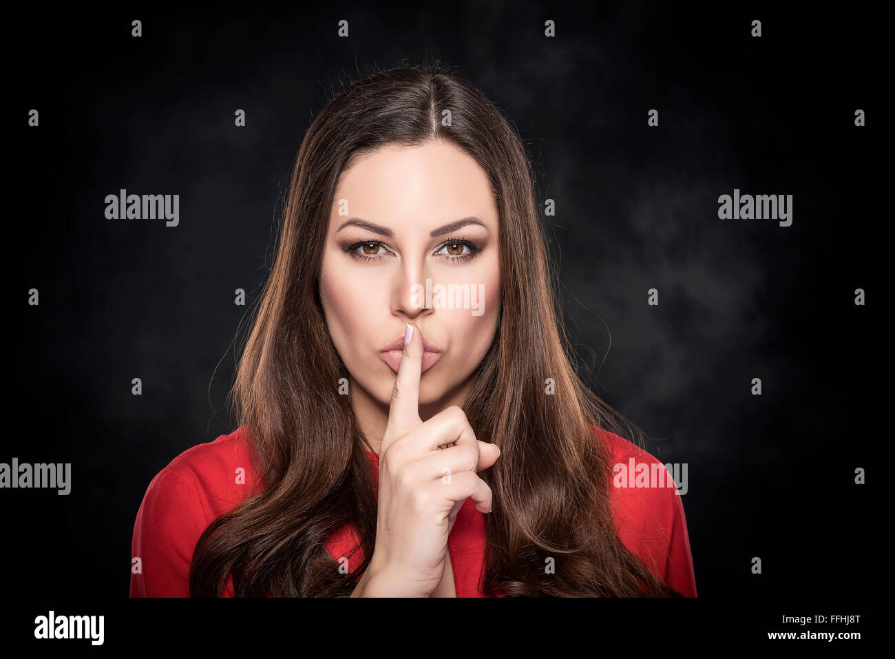 Finger near the lips of the lips hi-res stock photography and images ...