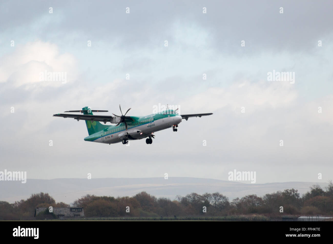 Aer Lingus Regional ATR 72-600 twin-engine turboprop short-haul regional airliner (EI-FAU, 'St. Daire') taking off. Stock Photo