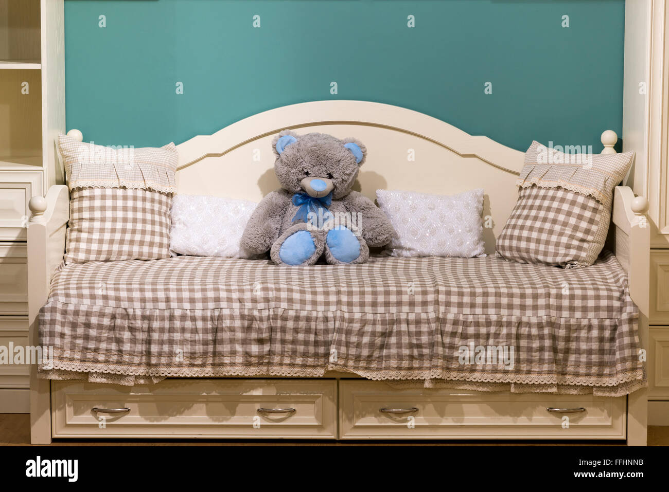 Detail of bedrooms for girls with a teddy bear Stock Photo