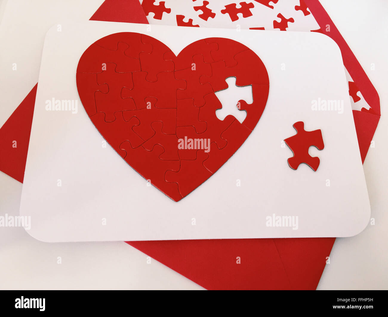 Valentine's Day Card with a heart shaped jigsaw puzzle Stock Photo