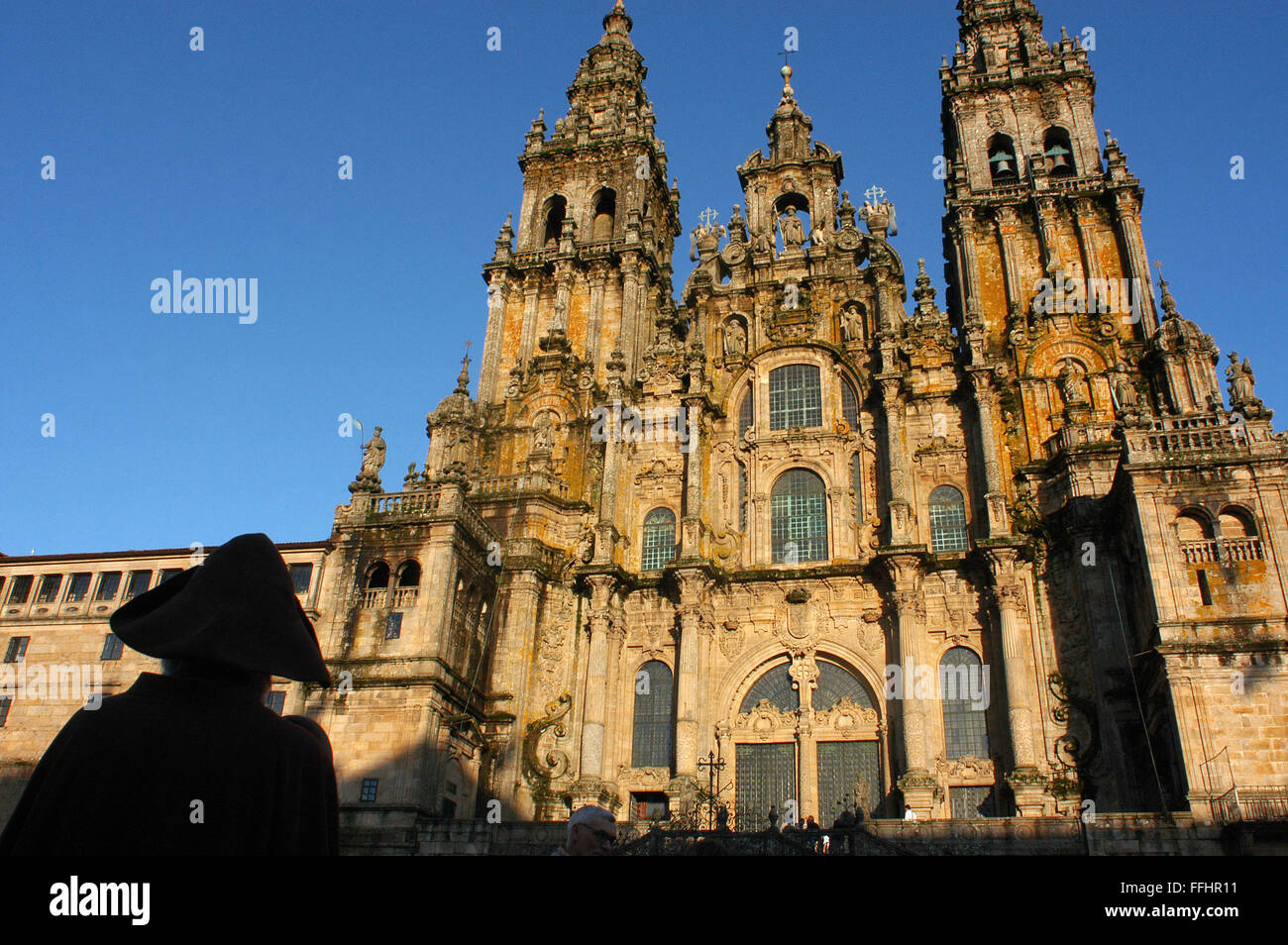 Way of St. James, Jacobean Route. Pilgrim in the Santiago's cathedral. Praza do Obradoiro. Santiago de Compostela. St. James's W Stock Photo