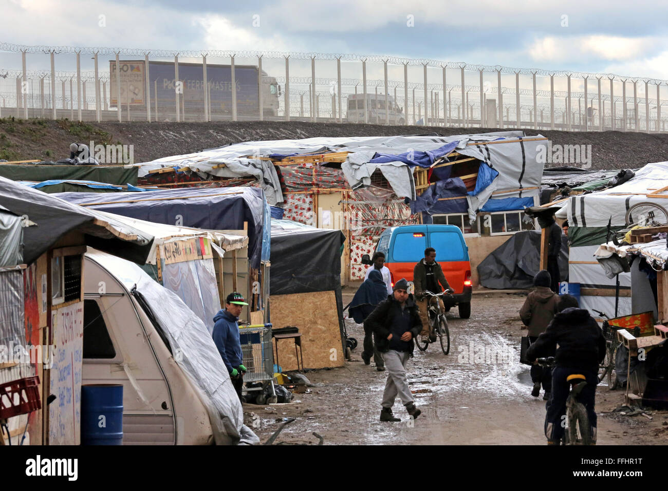 Refugee Camp Jungle In Calais France In The Background The