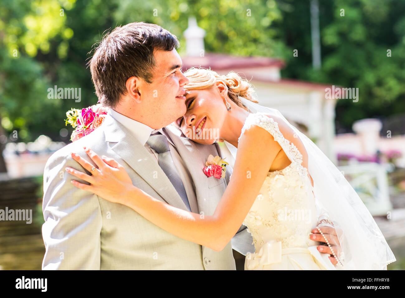 Young wedding couple enjoying romantic moments Stock Photo - Alamy