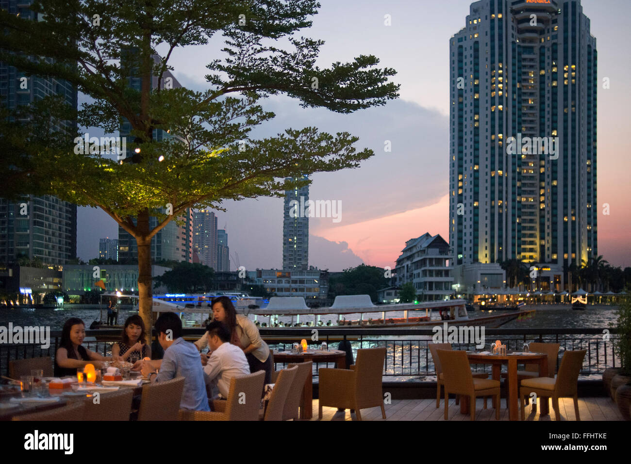 Chao Phraya viws. Terrace Restaurant, River, Lounge, Hotel, Shangri La, Bangkok, ,Thailand, Asia. You lay back on your long-tail Stock Photo