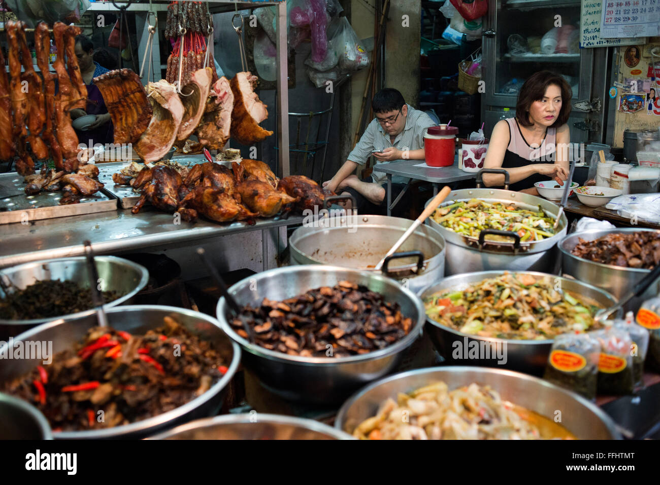 Market stall and street food being prepared in Chinatown Bangkok, Thailand. Yaowarat, Bangkok’s Chinatown, is the World’s most r Stock Photo