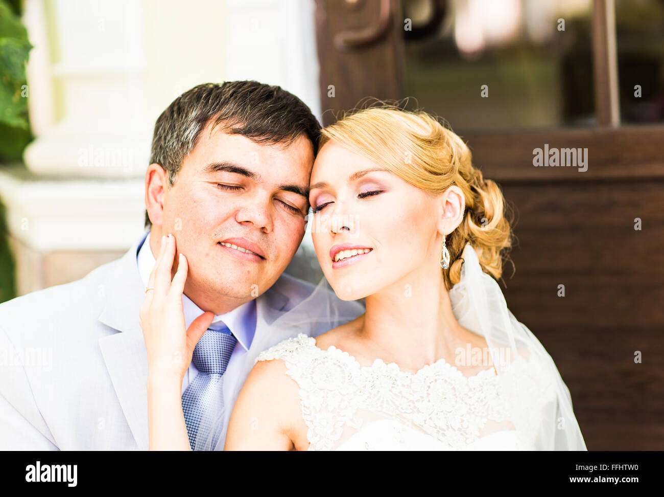Young wedding couple enjoying romantic moments Stock Photo - Alamy