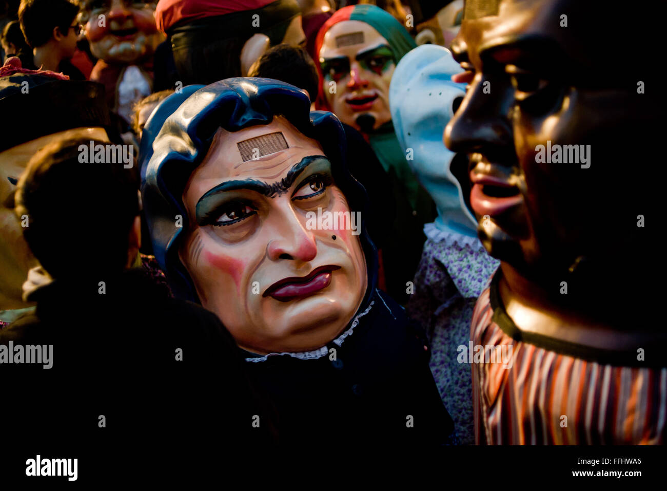 Traditional capgrossos (or cardboard  big heads) are seen in Barcelona, Spain, during the Santa Eulalia winter Festival. Stock Photo