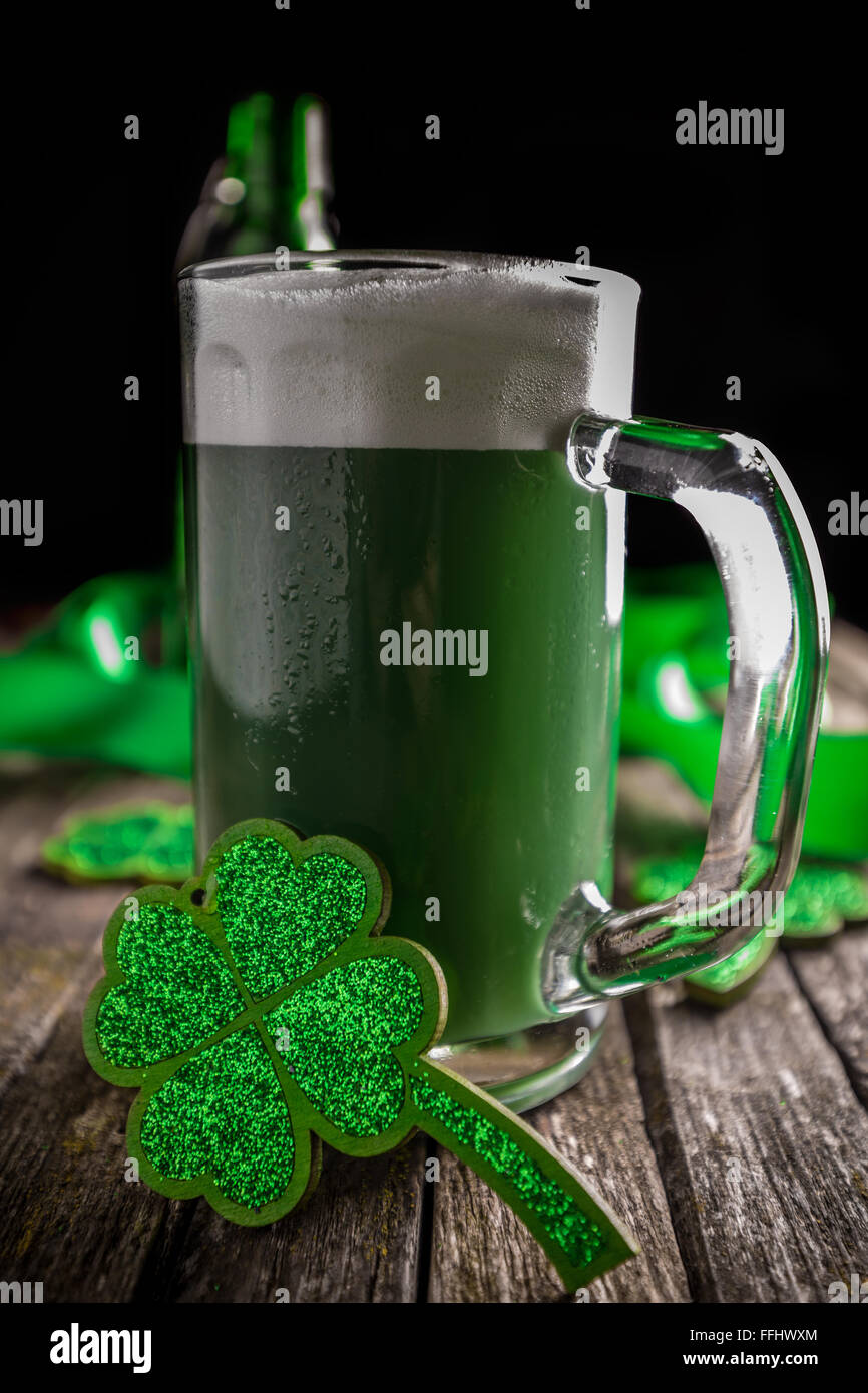 St. Patrick's day holiday celebration, lucky clover and green beer Stock Photo
