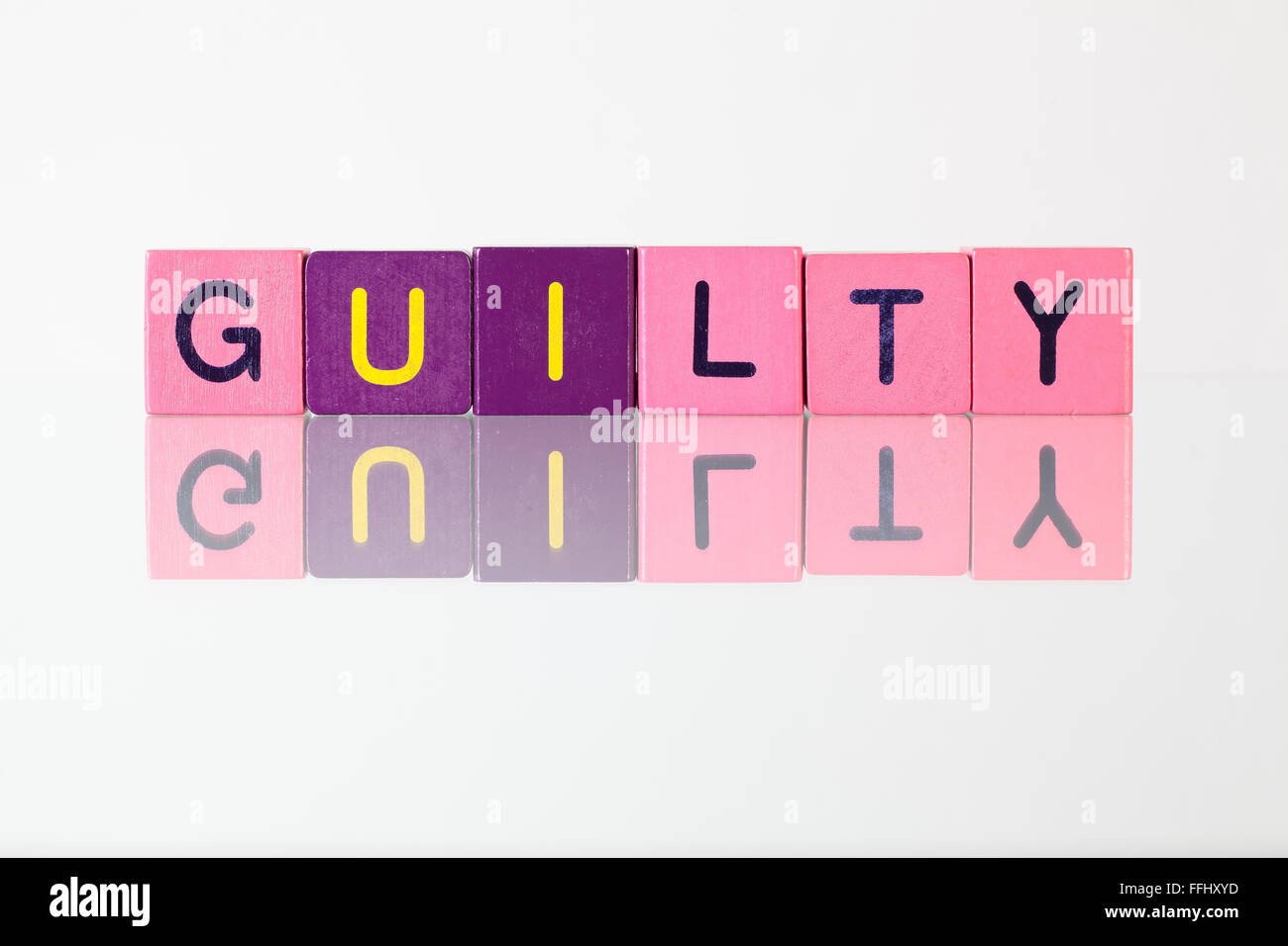 Guilty - an inscription from children's wooden blocks Stock Photo - Alamy
