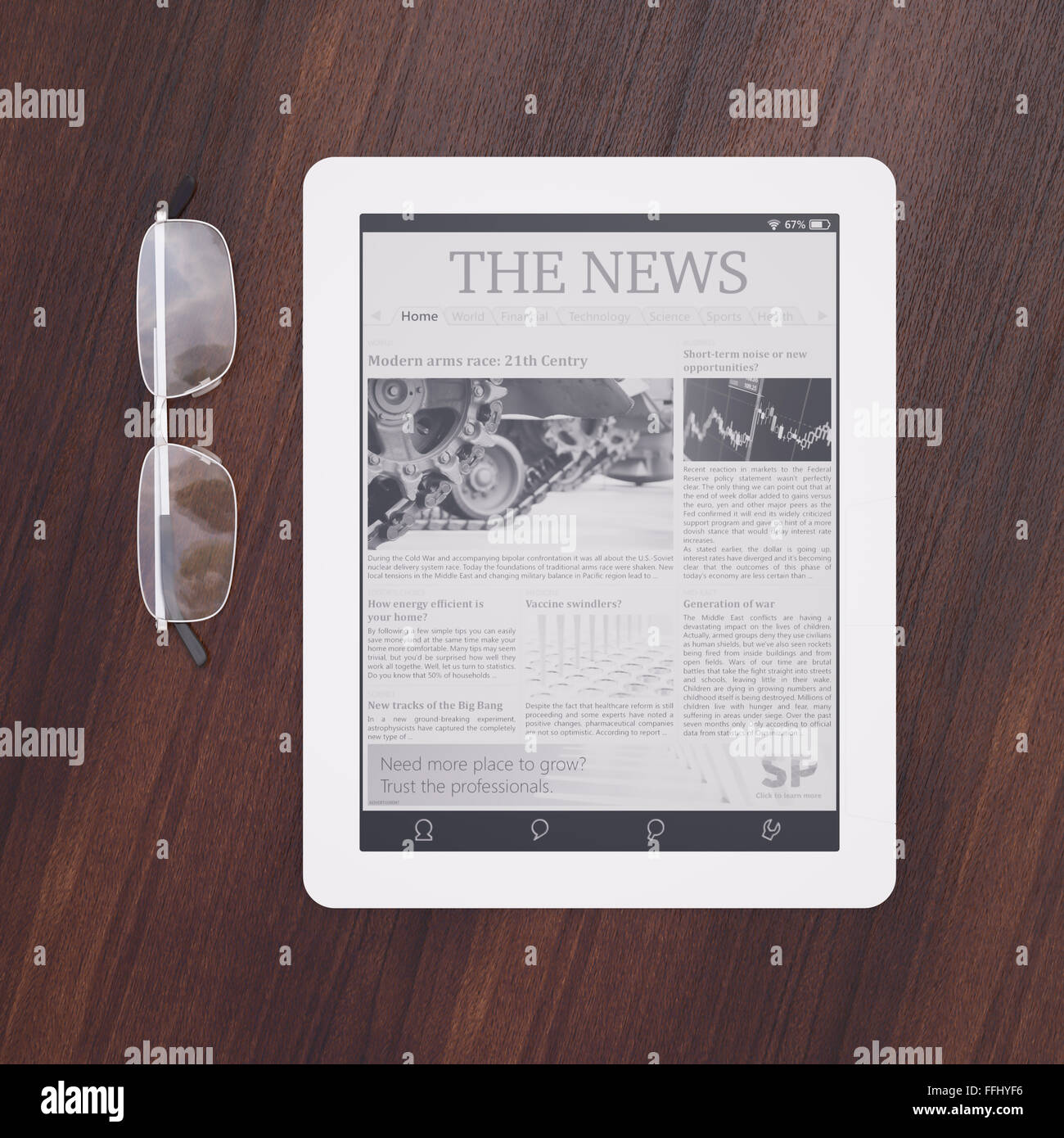 Ereader with newspaper application and glasses top view Stock Photo