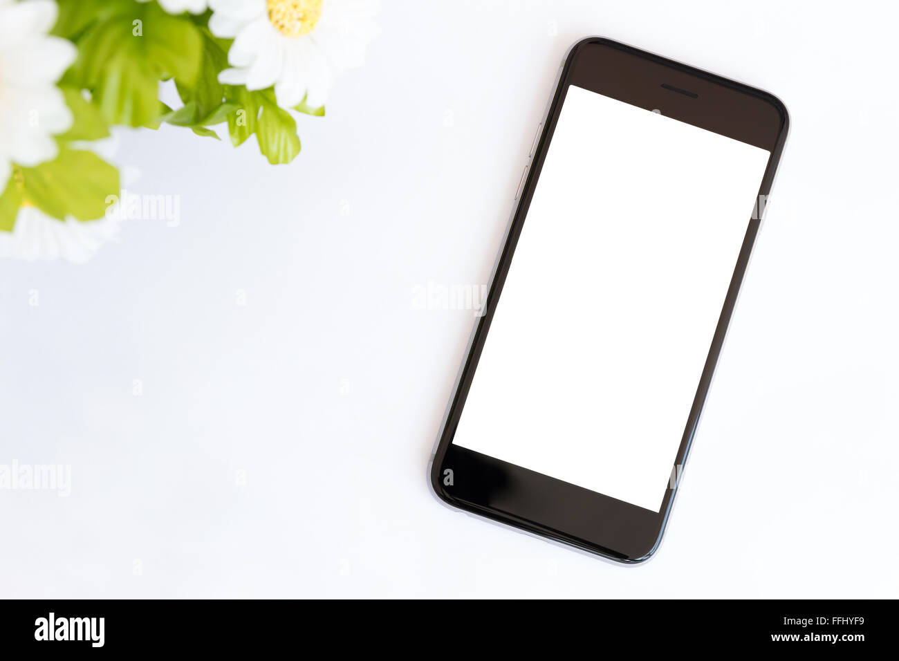 smart phone white screen on white desk Stock Photo