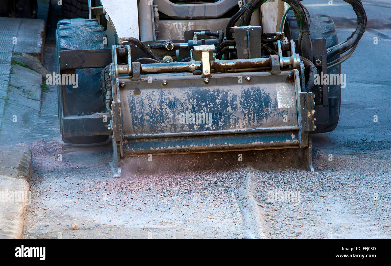 Milling of asphalt for road reconstruction accessory for skid steer