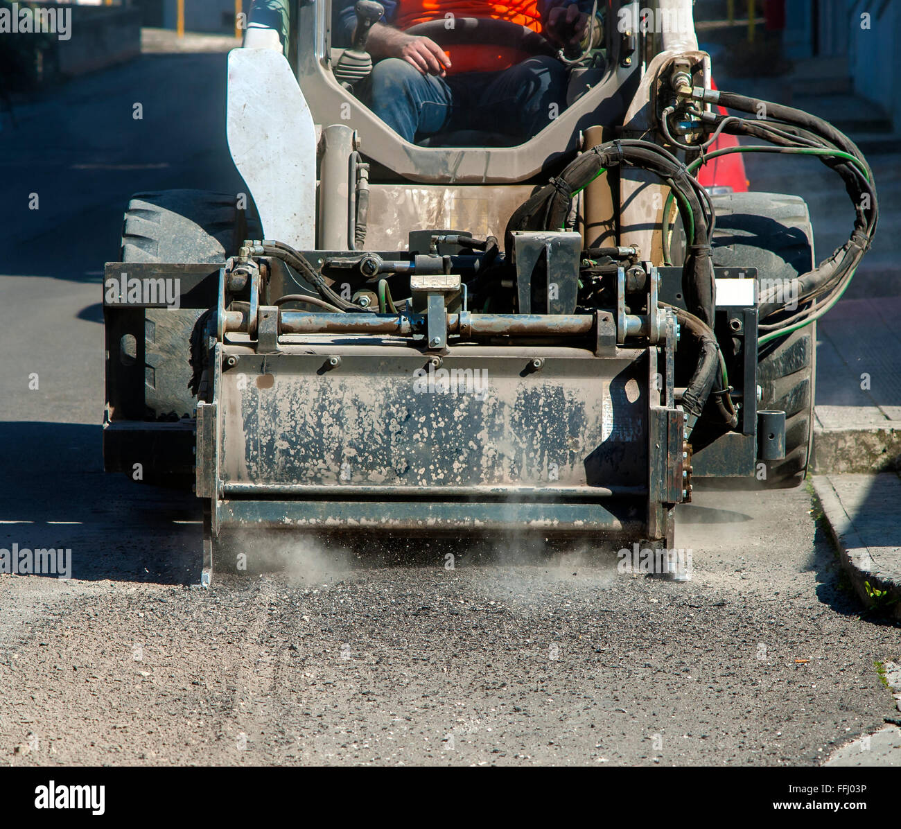 Milling of asphalt for road reconstruction accessory for skid steer