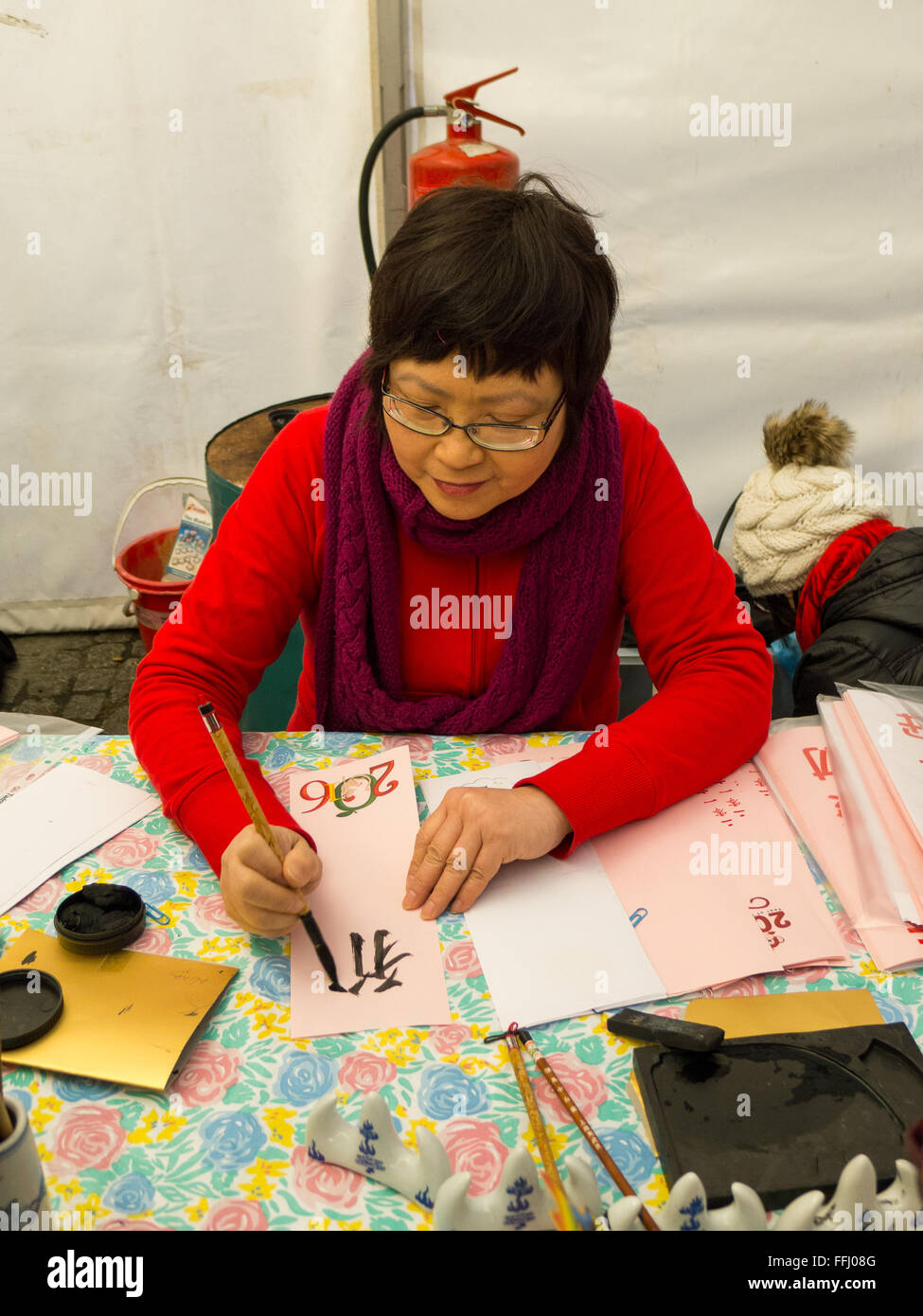 Chinese lady writing mandarin script Stock Photo