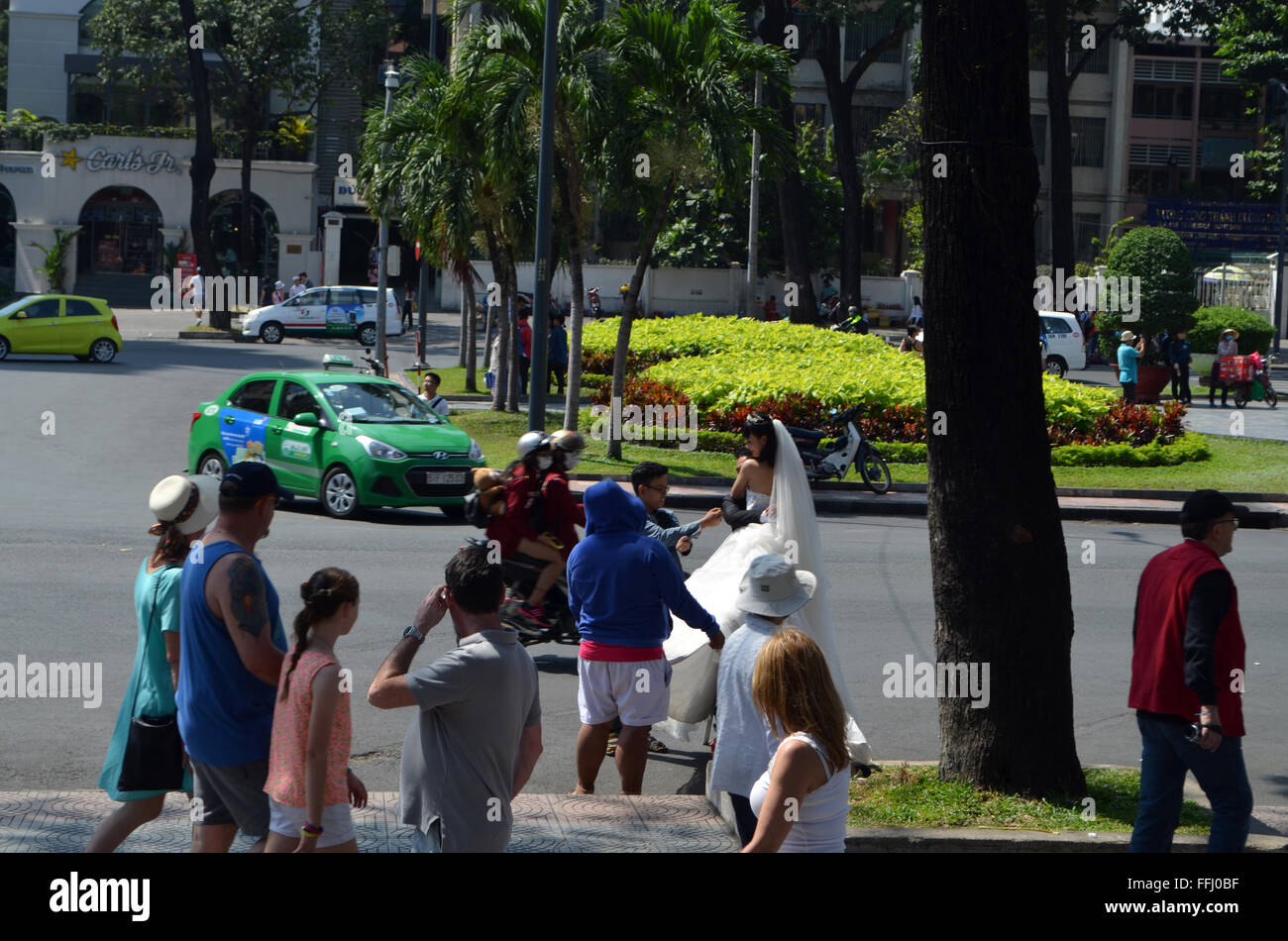 A bride is posed in front of the Cathedral in the street to make an unusual setting for her wedding photos Stock Photo
