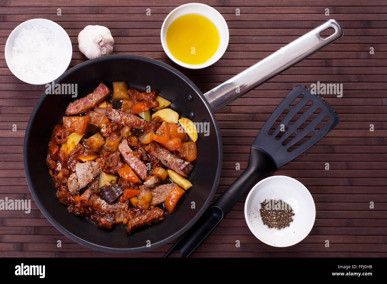 Braised veal with eggplant and other vegetables in a pan. Stock image. Stock Photo