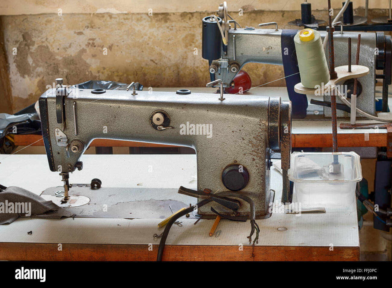 Abandoned tailoring - sewing machines Stock Photo