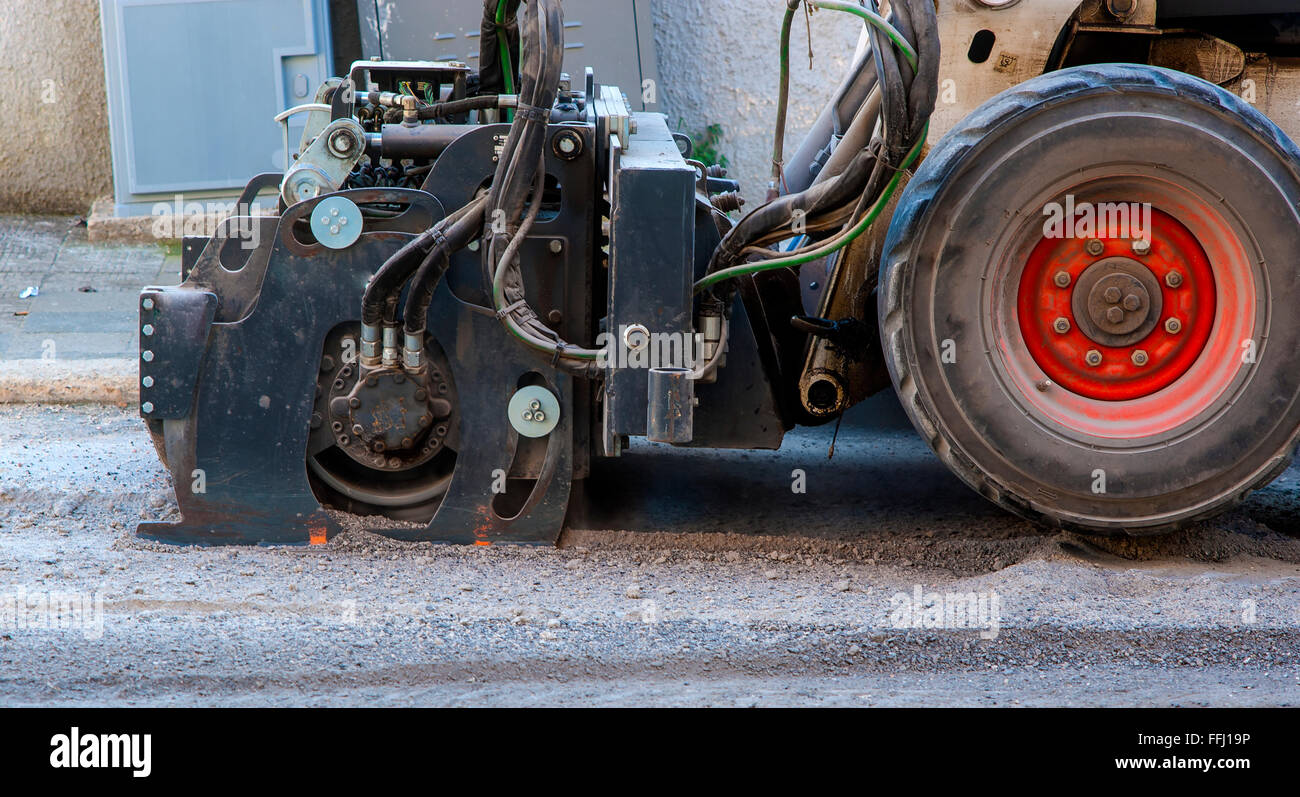 Milling of asphalt for road reconstruction accessory for skid steer