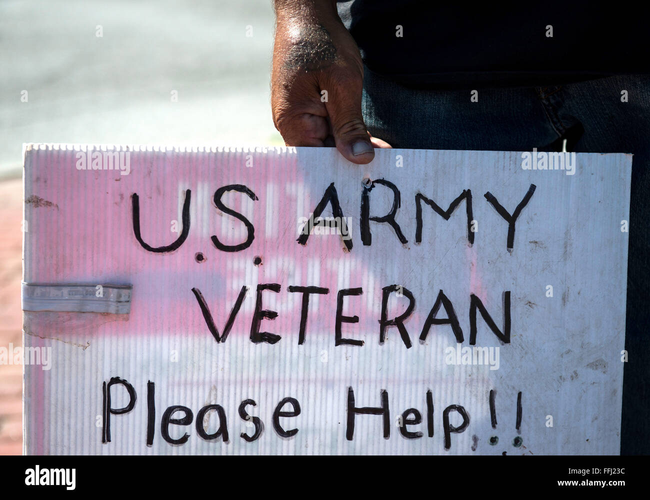 Raymond Anthony Capla, a homeless Army veteran, panhandles on roads in central San Gabriel Valley September 28, 2015 in Los Angeles, California. Stock Photo