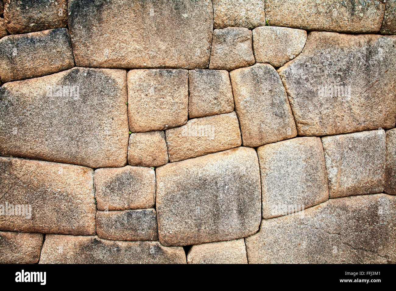 The tight stonework of the Incas.  Machu Picchu, Peru. Stock Photo