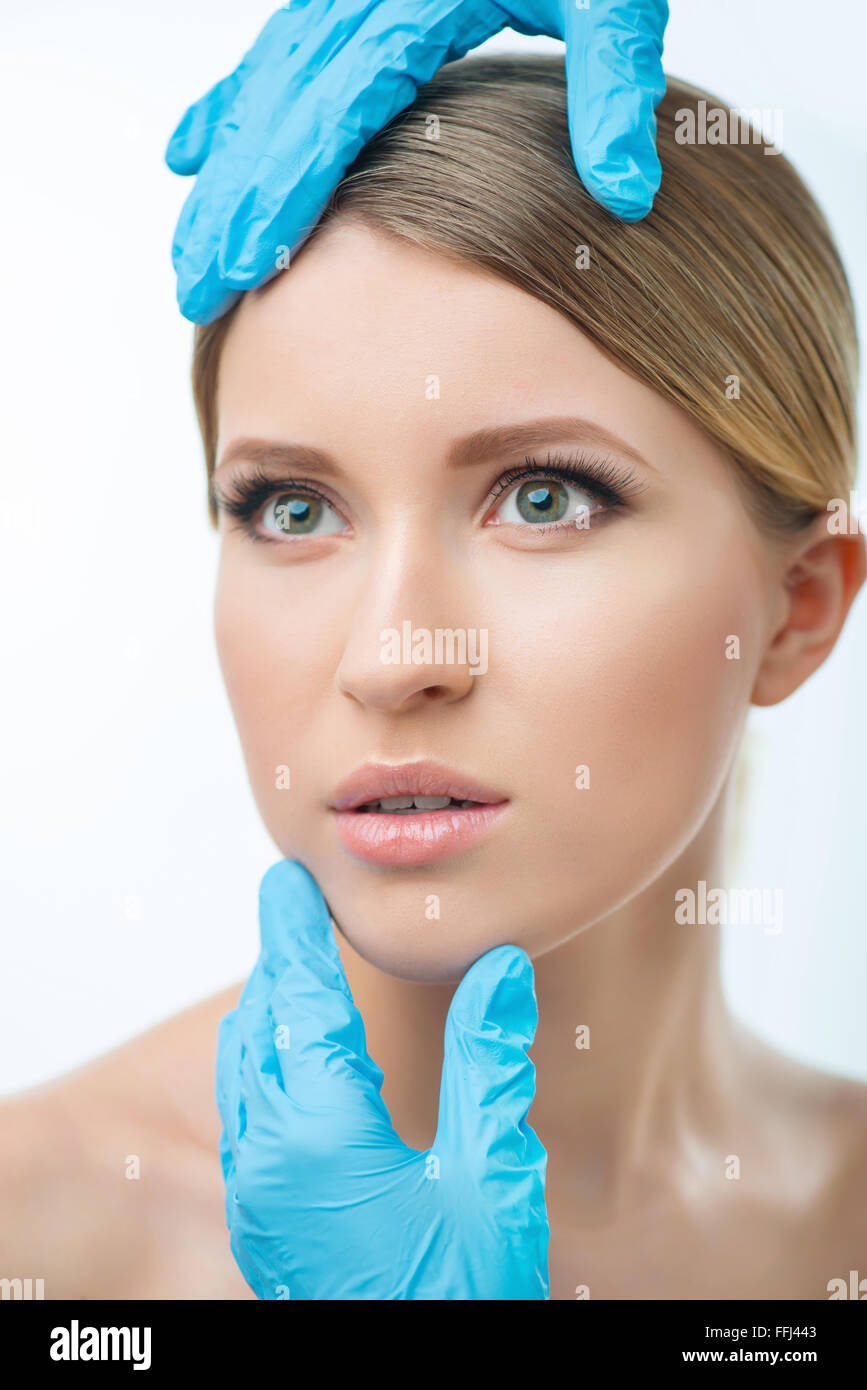Plastic surgeon examining woman Stock Photo Alamy